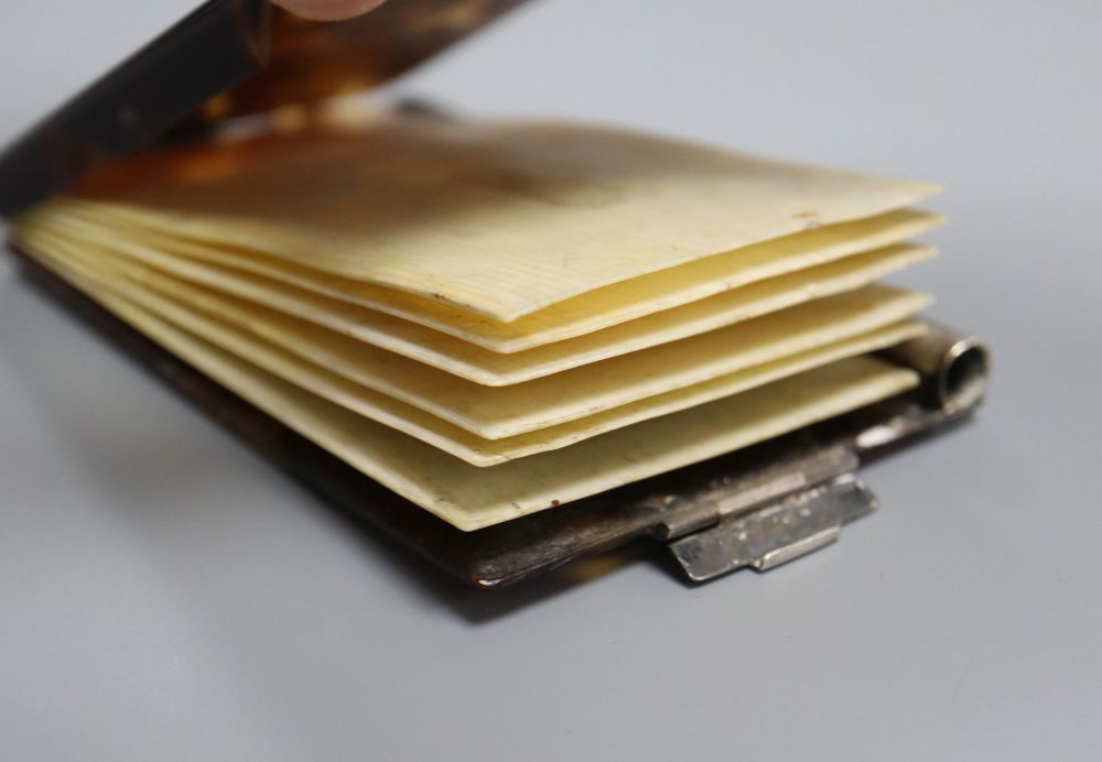 A silver mounted cigarette box. 19.5cm, a silver card case and a tortoiseshell and ivory aide memoir.